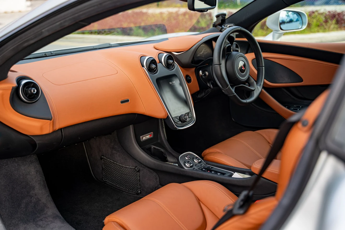 Clean leather seating and carefully finished surfaces in a premium car interior